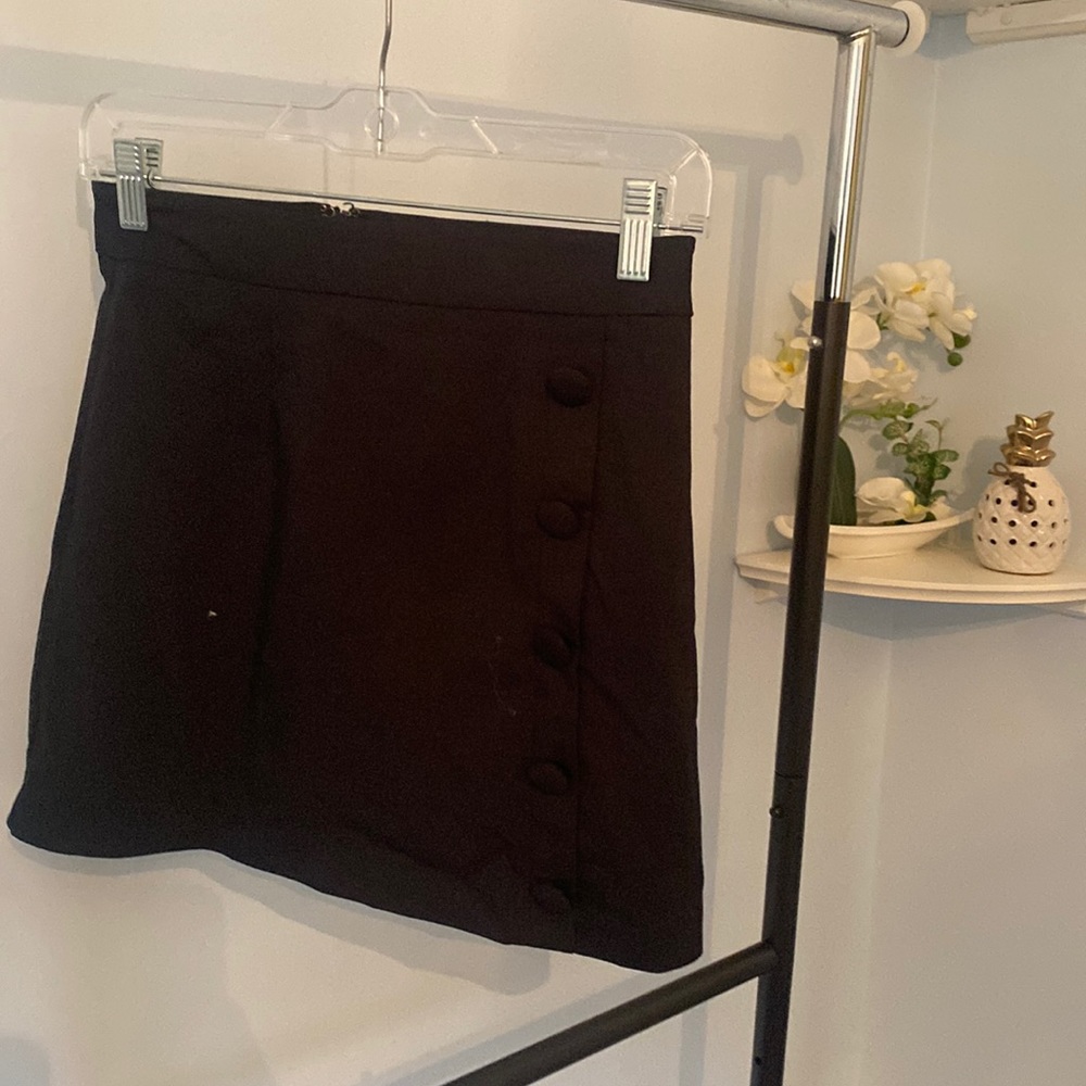 Black mini skirt with side button detail